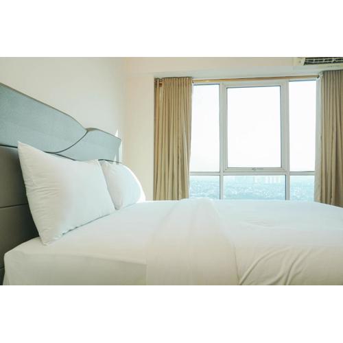 Cozy Living 1BR at Tifolia Apartment By Travelio