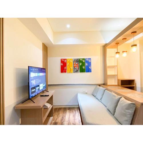 Cozy Living and Relaxing 2BR Meikarta Apartment By Travelio