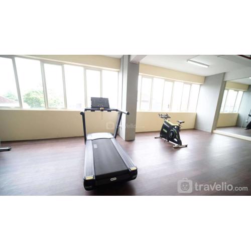 Cozy Living and Tidy 2BR at Puncak Dharmahusada Apartment By Travelio