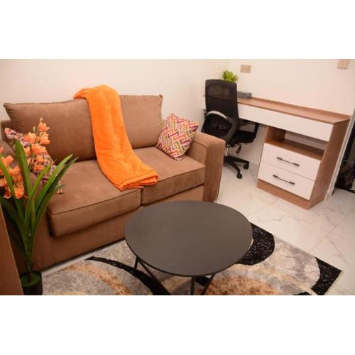 Cozy partitioned studio in Smarthomes Serviced Apartment-Kilimani