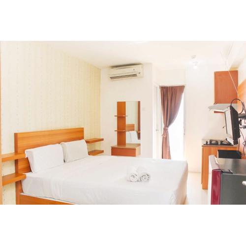 Cozy Studio at Bassura City Apartment By Travelio