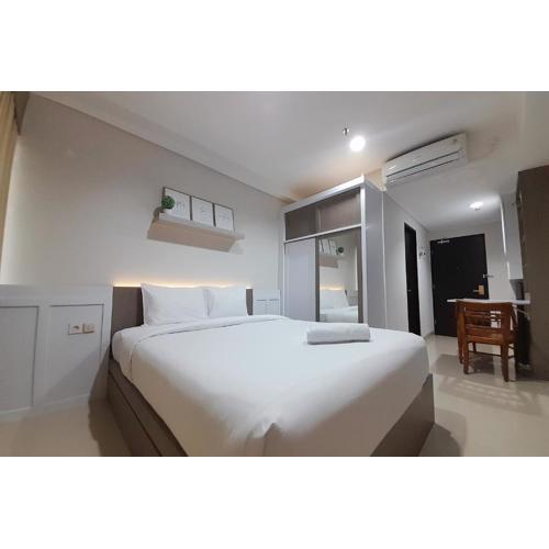 Cozy Studio Room at Patraland Amarta Apartment By Travelio