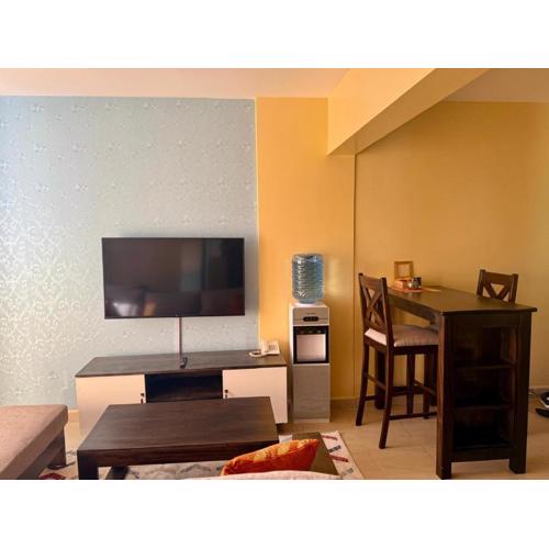 Deluxe studio with a balcony view overlooking the Nairobi town skyline