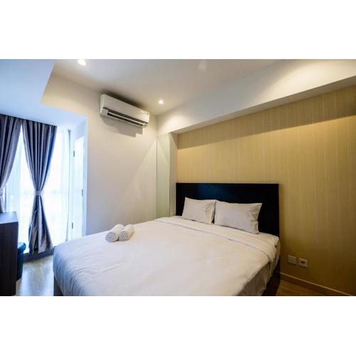 Elegant 1BR Branz BSD Apartment near AEON Mall By Travelio