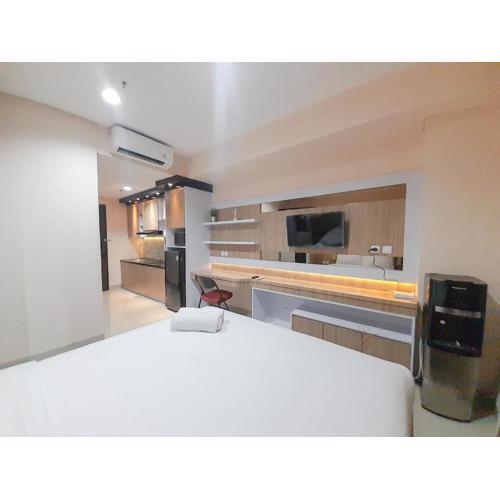 Elegant and Comfortable Studio Patraland Amarta Apartment By Travelio