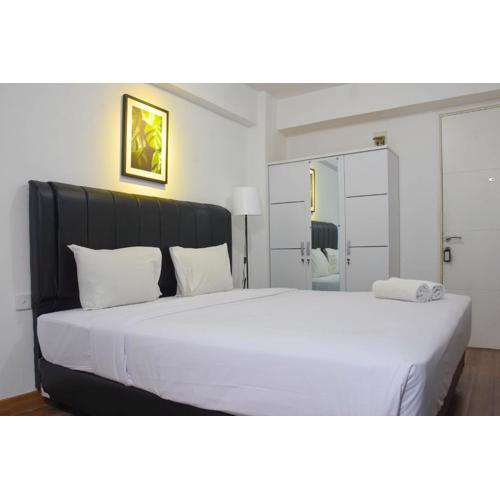 Elegant and Comfy Studio at Bassura City Apartment By Travelio