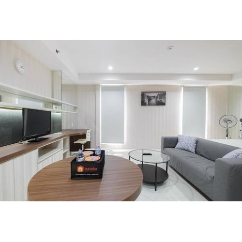 Elegant and Comfy Studio Azalea Suites Apartment Cikarang By Travelio