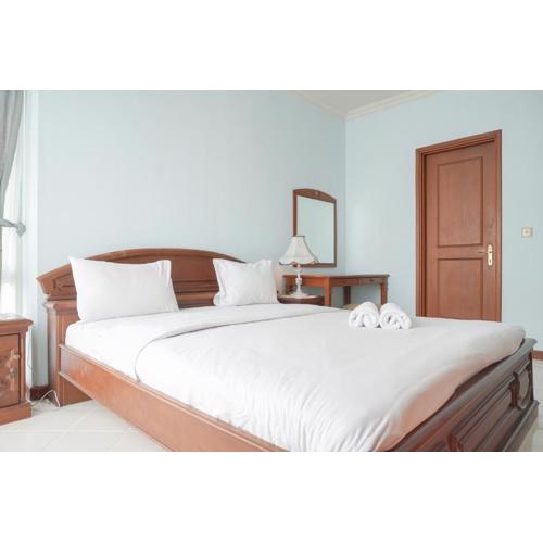 Elegant and Homey 2BR Apartment at Puri Casablanca By Travelio