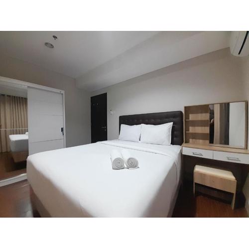 Elegant and Spacious 1BR at Patraland Amarta Apartment By Travelio