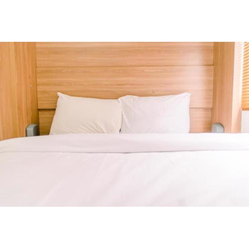 Elegant and Tidy 2BR Green Pramuka City Apartment near Mall By Travelio