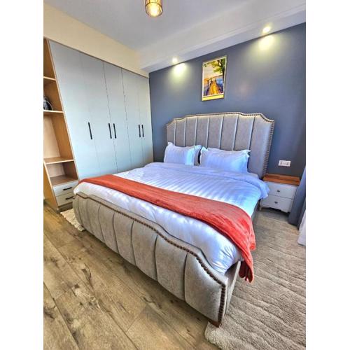 elegant urban escape apartment with heated swimming pool, fully equipped gym,children playing ground,amazing city views and private parking space