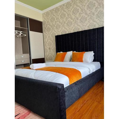 executive catchy two bedroom with heated swimming pool fully furnished gym ample parking space children playing ground and a relaxing rooftop with an amazing city views