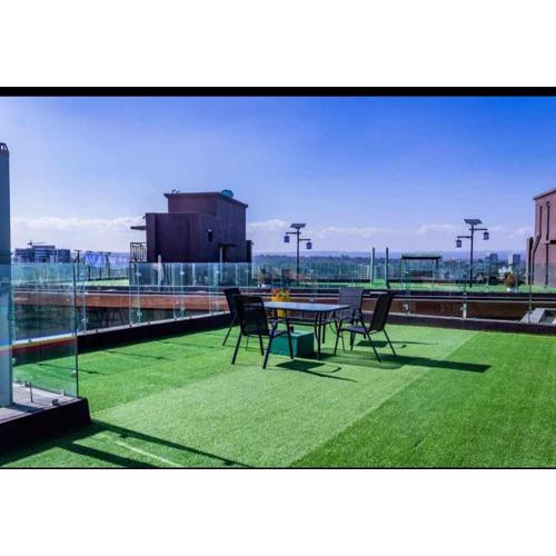 executive cozy apartment with fully equipped gym heated swimming pool and amazing scenic city views and ample parking and children playing ground