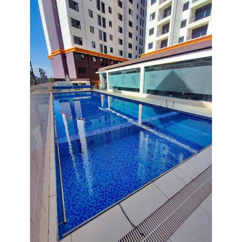 executive living two bedroom apartment with fully equipped gym heated swimming pool ample parking and children playing ground and amazing scenic city views