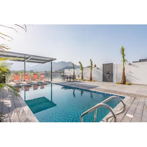 Facing the Sea and Mountains 4BR Villa with Assistant Room and Private Pool, Al Dana Island, Fujairah by Deluxe Holiday Homes