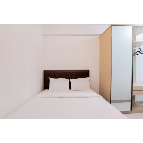 Fully Furnished 1BR with Study Room at Serpong Garden Apartment By Travelio