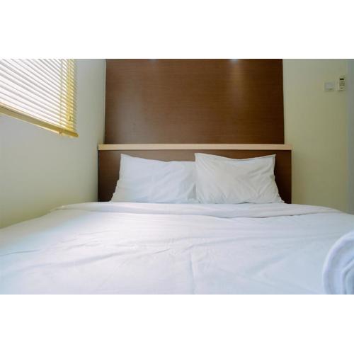 Fully Furnished and Cozy 2BR at Green Pramuka City Apartment By Travelio