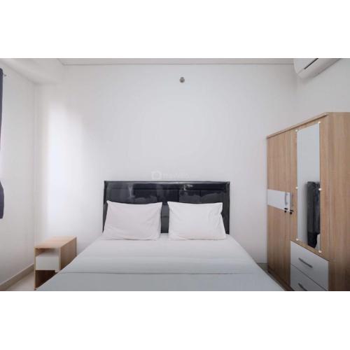 Fully Furnished and Cozy 2BR at Transpark Cibubur Apartment By Travelio