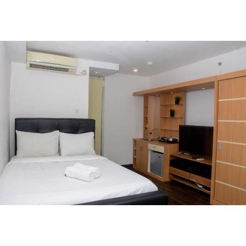 Fully Furnished with Cozy Design Studio Bassura City Apartment By Travelio