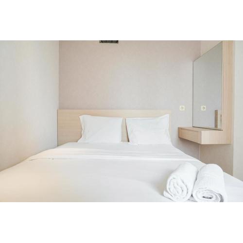 Fully Furnished with Elegant Design 2BR Bassura City Apartment By Travelio