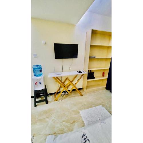 furnished two bedroom apartment with swimming pool, fully equipped gym, private parking space ,children playground and unbeatable scenic city views in kilimani