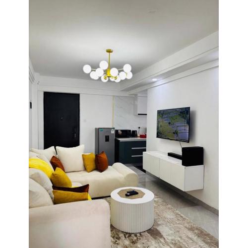 furnished two bedroom apartment with swimming pool, fully equipped gym, private parking space ,children playground and unbeatable scenic city views in kilimani