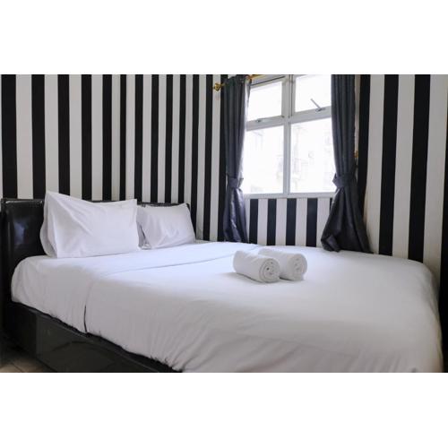 Good Deal 2BR at 16th Floor Suites @Metro Apartment By Travelio