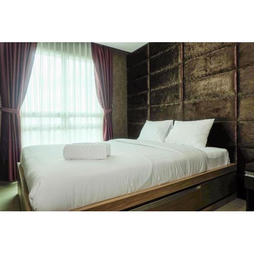 Good Location with Simply Furnished 1BR Apartment Woodland Park Residence By Travelio