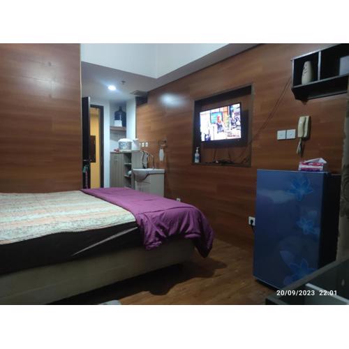 Grand Dhika Apartement by 2325 Studio room with cozy wooden style room