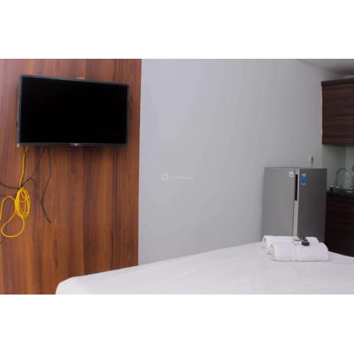 Great Location Studio Room at Patraland Urbano Apartment By Travelio