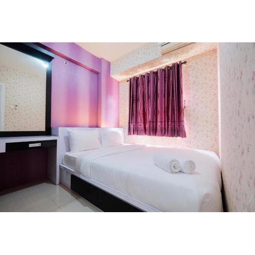 Homey 1BR with Spacious Living Room Green Pramuka City Apartment By Travelio