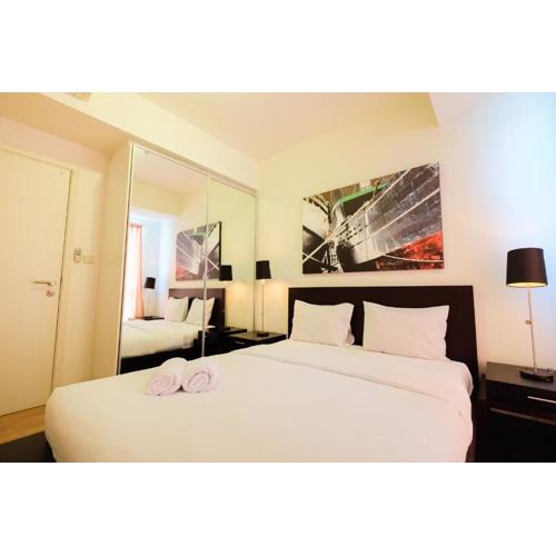 Homey 2BR Apartment at Casa Grande Residence By Travelio