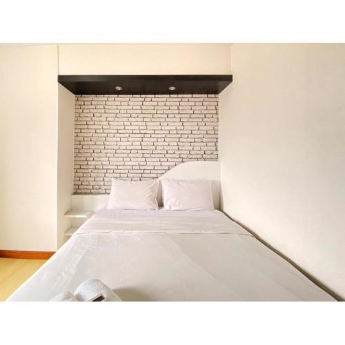 Homey 2BR at Gateway Ahmad Yani Cicadas Apartment By Travelio