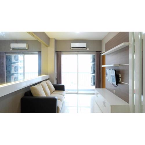 Homey 2BR at Puncak Bukit Golf Surabaya Apartment By Travelio