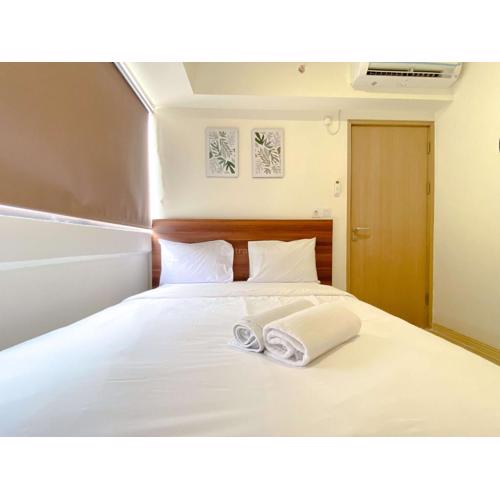 Homey 2BR with Work Space at Meikarta Apartment By Travelio