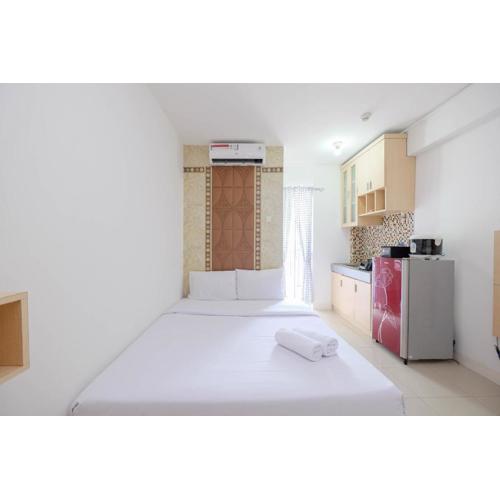 Homey and Comfort Living Studio Room at Bassura City Apartment By Travelio