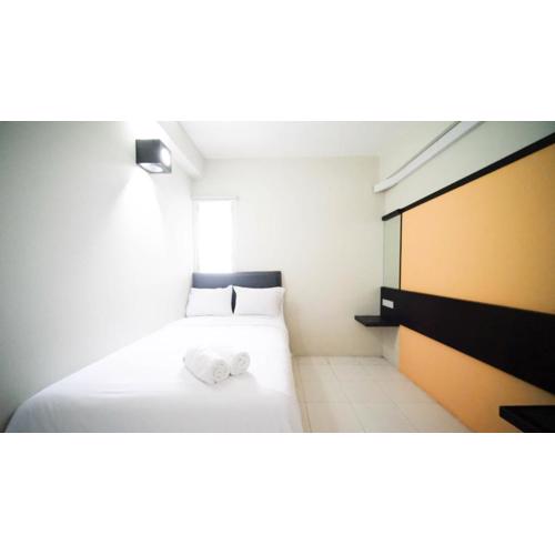 Homey and Comfy 2BR at Dian Regency Apartment By Travelio