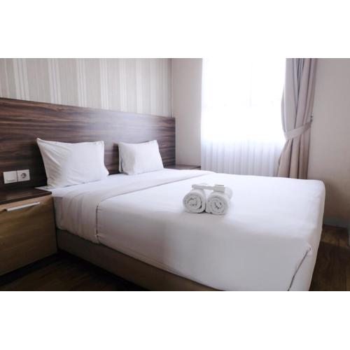 Homey and Cozy 2BR at Mekarwangi Square Cibaduyut Apartment By Travelio