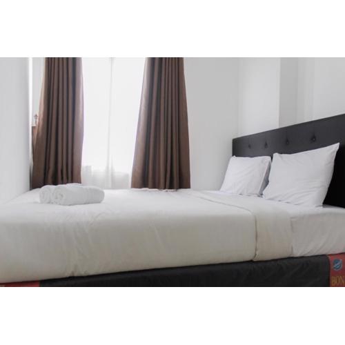 Homey and Cozy 2BR Bassura City Apartment near Mall By Travelio