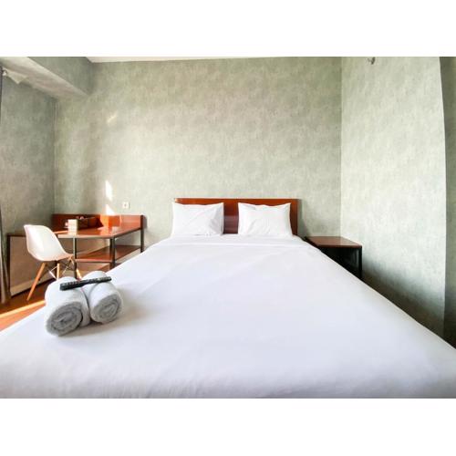 Homey and Good Choice Studio at Amartha View Apartment By Travelio