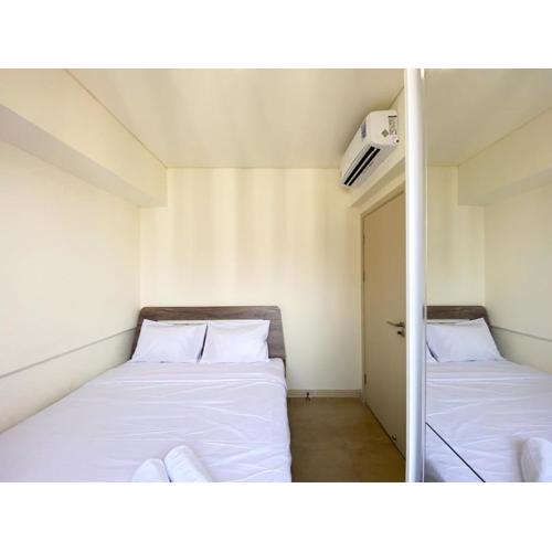 Homey and Minimalist 2BR at Meikarta Apartment By Travelio