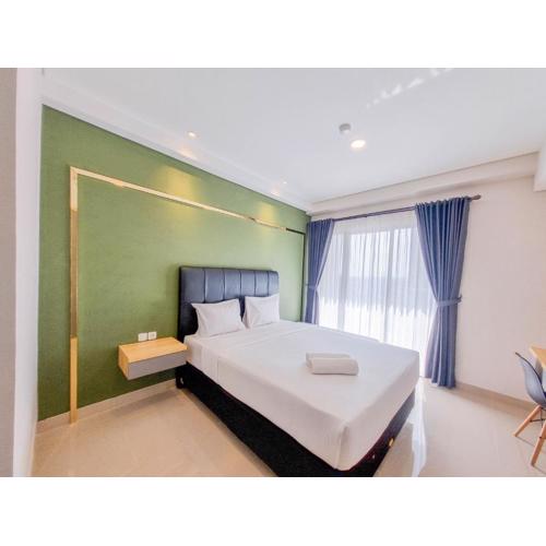 Homey and Minimalist Studio at Patraland Amarta Apartment By Travelio