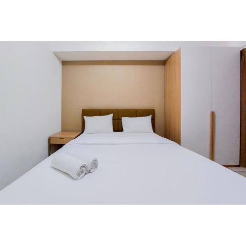 Homey and Modern 2BR Apartment at M-Town Residence By Travelio