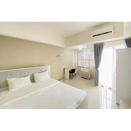 Homey and Nice 1BR at Gateway Park LRT City Bekasi Apartment By Travelio