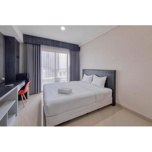 Homey and Scenic Studio at Patraland Amarta Apartment By Travelio