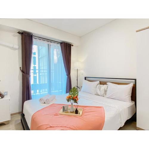 Homey and Spacious 2BR at Meikarta Apartment By Travelio