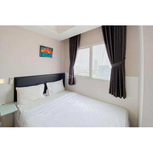 Homey and Warm 2BR at Signature Park Grande Apartment By Travelio
