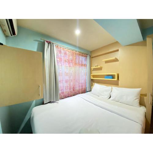 Homey Living 2BR at Jarrdin Cihampelas Apartment By Travelio