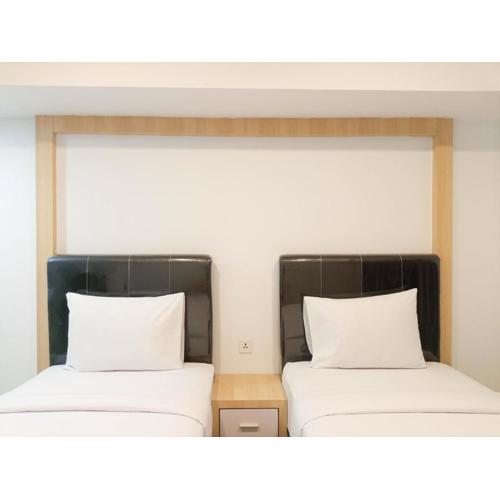 Homey Studio at De Prima Apartment By Travelio