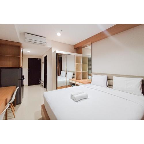 Homey Studio at Patraland Amarta Apartment By Travelio